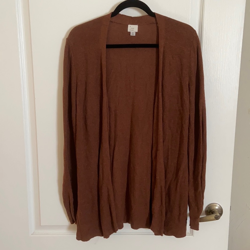 A new day sweater, lightly worn